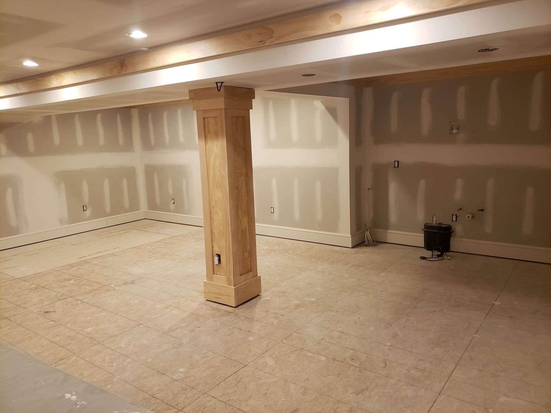 Home 2 Basement, framed to finished, before
