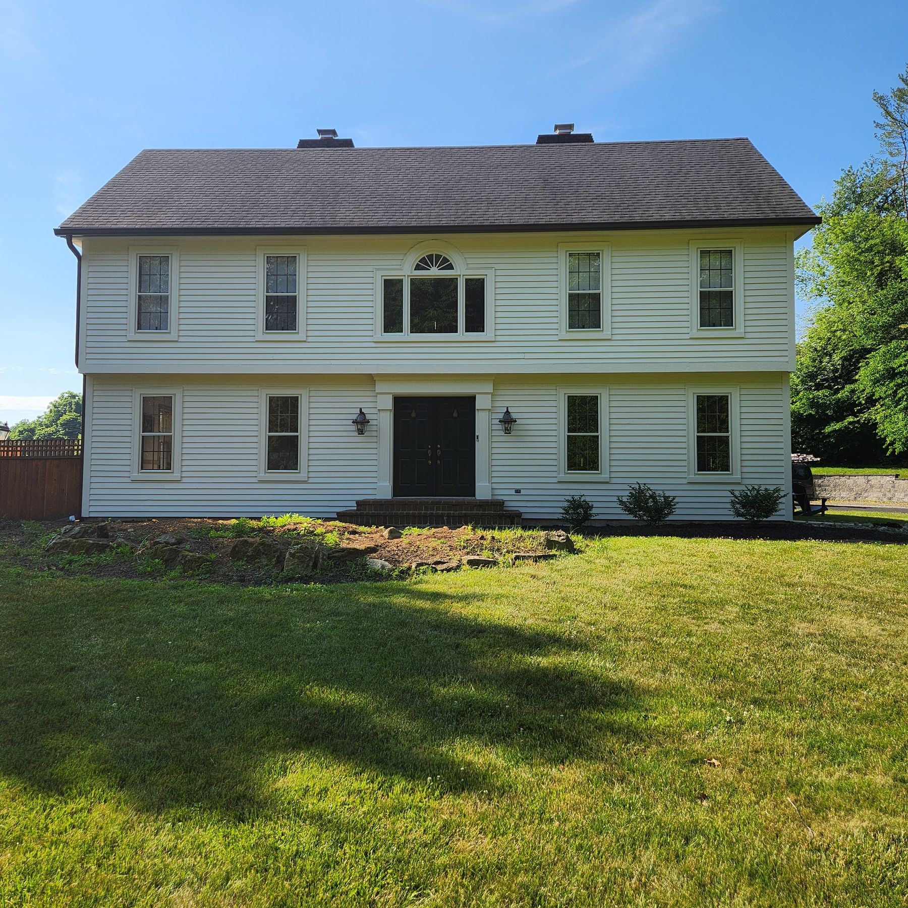 Home 10 Colonial home with a fresh cream exterior