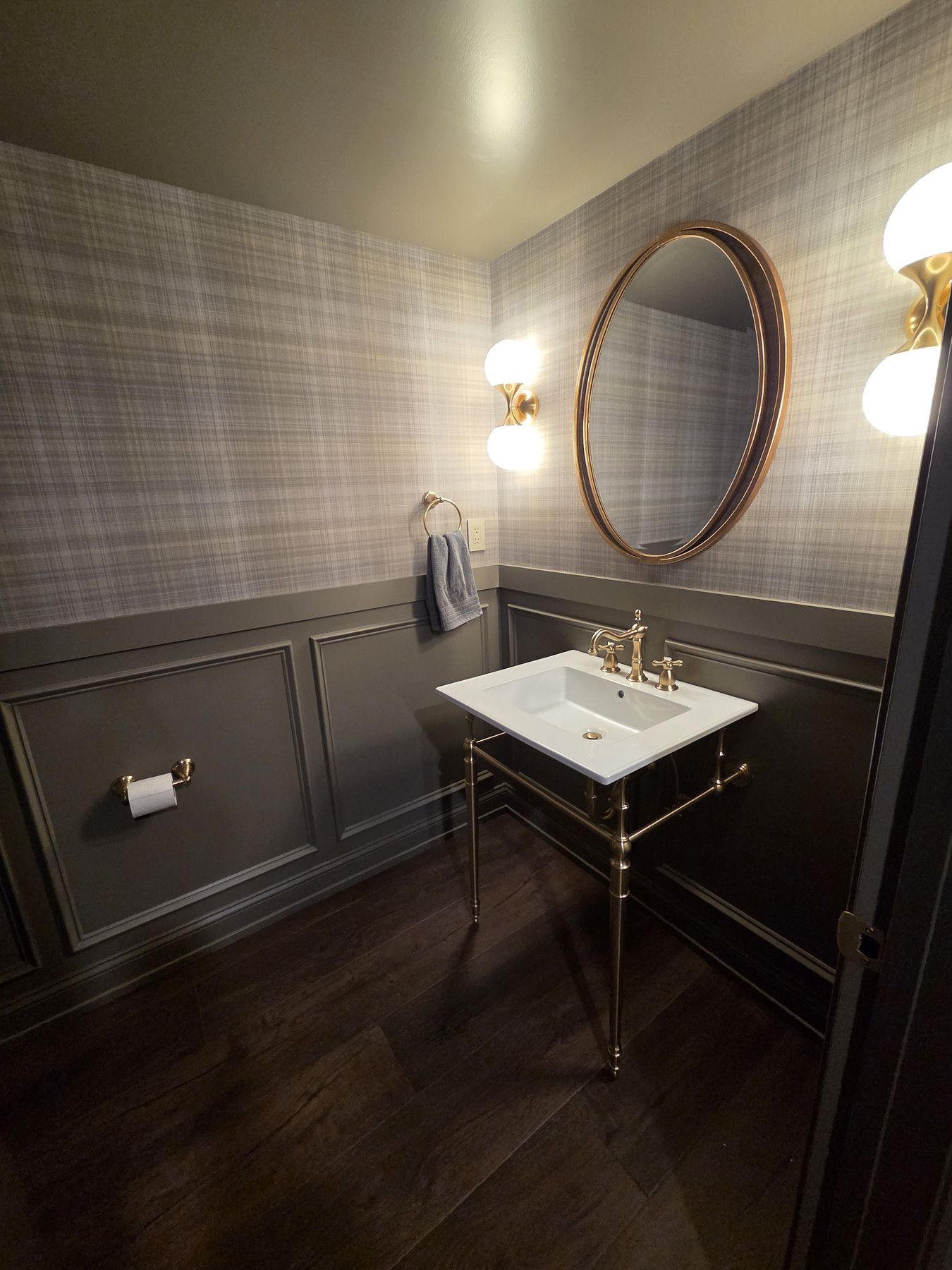 Home 7 Powder room with dark wainscoting and plaid wallpaper
